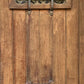 Brown door with bars