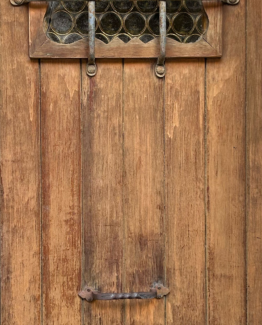 Brown door with bars